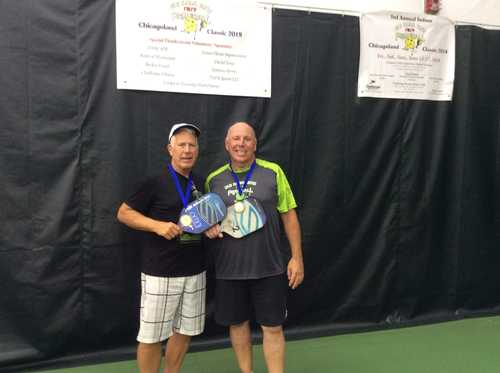 Coach Jim and partner with gold medals at the 2018 Chicagoland Classic